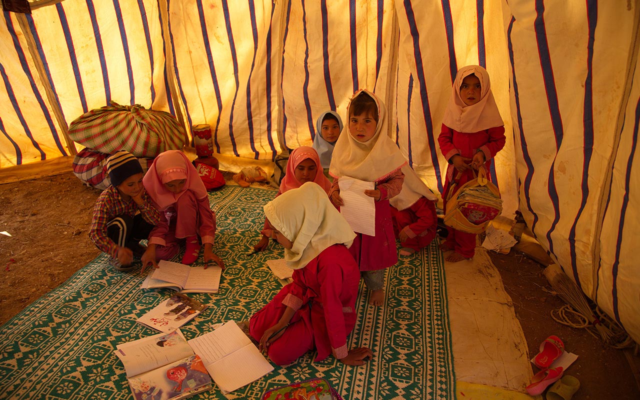 Children learning in a nomadic school tent